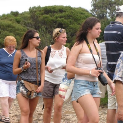 a group of people standing in the dirt
