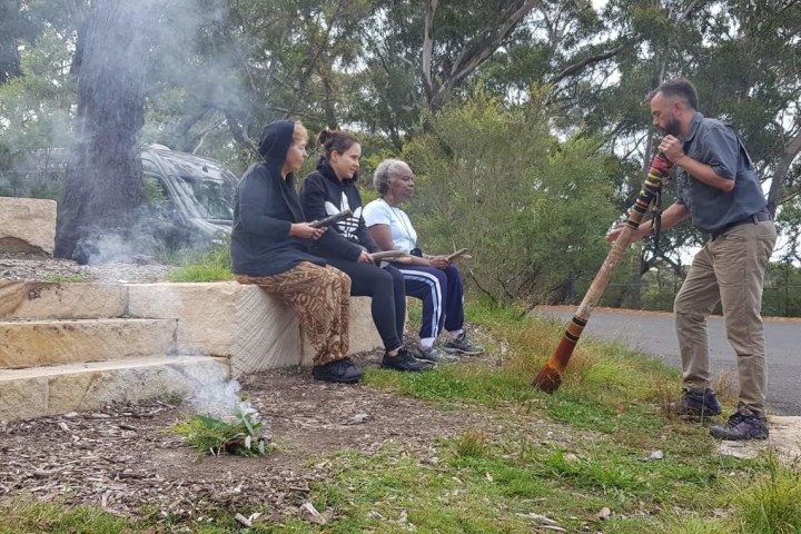 a man sitting in a park